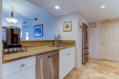 Escape the cold and embrace effortless Florida living in this on Isla Del Sol Yacht and Country Club in Florida - for sale on GolfHomes.com, golf home, golf lot