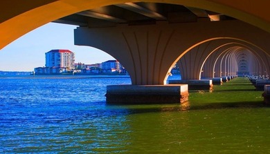 Escape the cold and embrace effortless Florida living in this on Isla Del Sol Yacht and Country Club in Florida - for sale on GolfHomes.com, golf home, golf lot