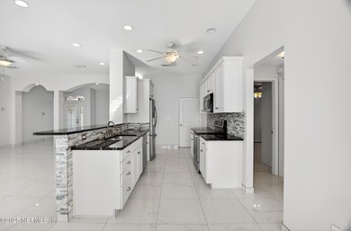 Live the Florida lifestyle in this pool home overlooking the St on St. Augustine Shores Golf Club in Florida - for sale on GolfHomes.com, golf home, golf lot