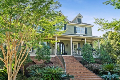 Nestled on a picturesque tree-lined street, this expansive home on Charleston National Golf Club in South Carolina - for sale on GolfHomes.com, golf home, golf lot