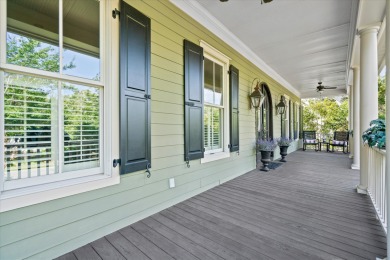 Nestled on a picturesque tree-lined street, this expansive home on Charleston National Golf Club in South Carolina - for sale on GolfHomes.com, golf home, golf lot