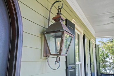 Nestled on a picturesque tree-lined street, this expansive home on Charleston National Golf Club in South Carolina - for sale on GolfHomes.com, golf home, golf lot