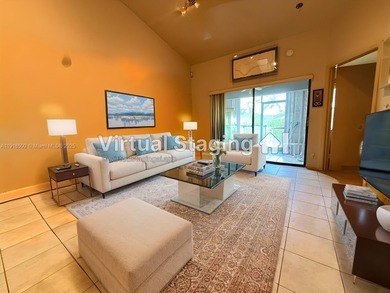 Enjoy gorgeous water views from the main living areas and the on Woodmont Country Club in Florida - for sale on GolfHomes.com, golf home, golf lot