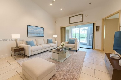 Enjoy gorgeous water views from the main living areas and the on Woodmont Country Club in Florida - for sale on GolfHomes.com, golf home, golf lot