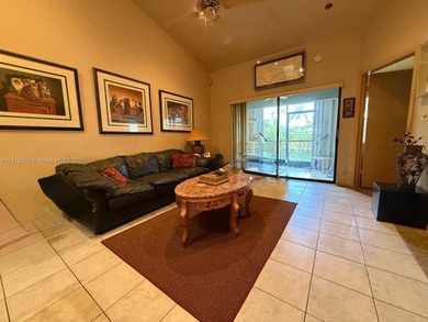 Enjoy gorgeous water views from the main living areas and the on Woodmont Country Club in Florida - for sale on GolfHomes.com, golf home, golf lot