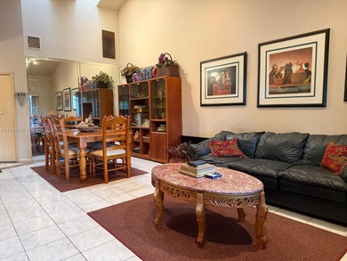 Enjoy gorgeous water views from the main living areas and the on Woodmont Country Club in Florida - for sale on GolfHomes.com, golf home, golf lot