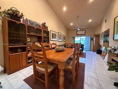 Enjoy gorgeous water views from the main living areas and the on Woodmont Country Club in Florida - for sale on GolfHomes.com, golf home, golf lot