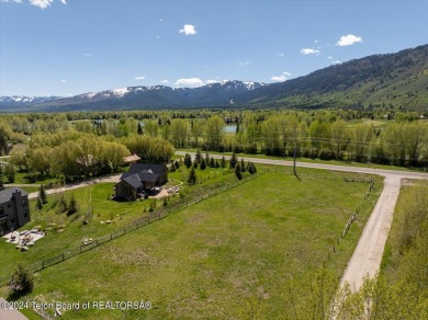 Rare vacant lot opportunity on the westbank of the Snake River on Teton Pines Golf Club in Wyoming - for sale on GolfHomes.com, golf home, golf lot