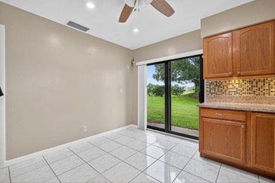 Welcome home to this beautifully updated single-story residence on Martin Downs Country Club in Florida - for sale on GolfHomes.com, golf home, golf lot
