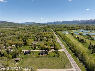 Rare vacant lot opportunity on the westbank of the Snake River on Teton Pines Golf Club in Wyoming - for sale on GolfHomes.com, golf home, golf lot