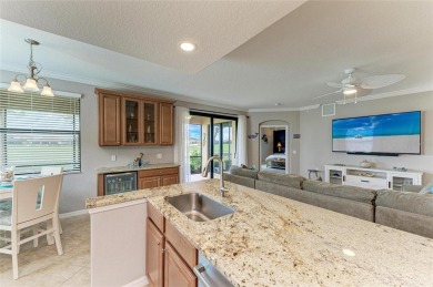 LOOKING FOR AN OPEN FLOOR PLAN COACH HOME IN RIVER STRAND, THIS on River Strand Golf and Country Club At Heritage Harbour  in Florida - for sale on GolfHomes.com, golf home, golf lot