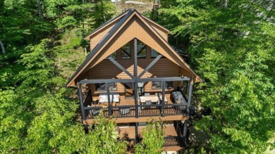 Discover this Custom Built Jubach Log Home perfectly placed on a on Hide-A-Way Hills Golf Club in Ohio - for sale on GolfHomes.com, golf home, golf lot