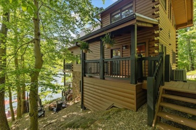 Discover this Custom Built Jubach Log Home perfectly placed on a on Hide-A-Way Hills Golf Club in Ohio - for sale on GolfHomes.com, golf home, golf lot
