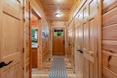 Discover this Custom Built Jubach Log Home perfectly placed on a on Hide-A-Way Hills Golf Club in Ohio - for sale on GolfHomes.com, golf home, golf lot