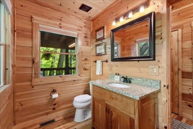 Discover this Custom Built Jubach Log Home perfectly placed on a on Hide-A-Way Hills Golf Club in Ohio - for sale on GolfHomes.com, golf home, golf lot