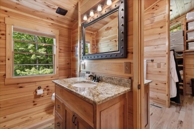 Discover this Custom Built Jubach Log Home perfectly placed on a on Hide-A-Way Hills Golf Club in Ohio - for sale on GolfHomes.com, golf home, golf lot