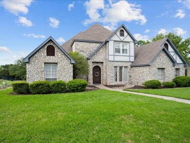 This stunning home, located at the corner of holes 15 and 16 on The Lake Country Club - Lake Waco in Texas - for sale on GolfHomes.com, golf home, golf lot