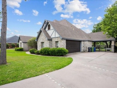This stunning home, located at the corner of holes 15 and 16 on The Lake Country Club - Lake Waco in Texas - for sale on GolfHomes.com, golf home, golf lot