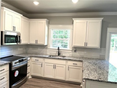 Needs paint, flooring and light deferred maintenance. Short sale on Bella Vista - Metfield Golf Complex and Country Club in Arkansas - for sale on GolfHomes.com, golf home, golf lot