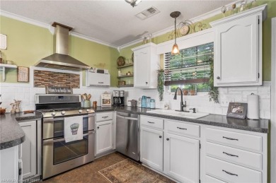 Come see this charming house on the corner! This 3 bed, 2 on Vache-Grasse Country Club in Arkansas - for sale on GolfHomes.com, golf home, golf lot