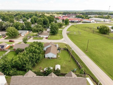 Come see this charming house on the corner! This 3 bed, 2 on Vache-Grasse Country Club in Arkansas - for sale on GolfHomes.com, golf home, golf lot