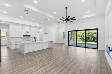 Welcome to this luxurious, modern, custom-built home perfectly on Rotonda Golf and Country Club - Long Marsh  in Florida - for sale on GolfHomes.com, golf home, golf lot