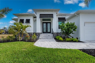 2023-built waterfront masterpiece in the highly sought-after on Saint Andrews South Golf Club in Florida - for sale on GolfHomes.com, golf home, golf lot