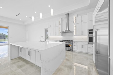 Brand-new modern estate in Palm City's prestigious Cobblestone on The Cape Club of Palm City in Florida - for sale on GolfHomes.com, golf home, golf lot