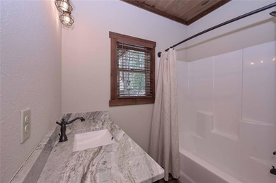 Nestled in the serene beauty of the North Georgia mountains on White Path Golf Club in Georgia - for sale on GolfHomes.com, golf home, golf lot