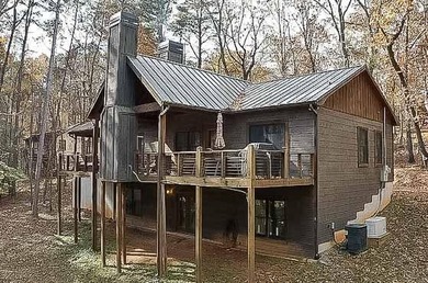 Nestled in the serene beauty of the North Georgia mountains on White Path Golf Club in Georgia - for sale on GolfHomes.com, golf home, golf lot