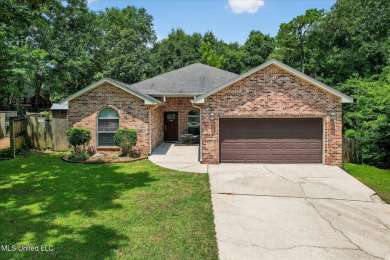 a beautifully maintained and thoughtfully upgraded 4-bedroom on Diamondhead Country Club in Mississippi - for sale on GolfHomes.com, golf home, golf lot