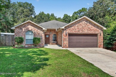 a beautifully maintained and thoughtfully upgraded 4-bedroom on Diamondhead Country Club in Mississippi - for sale on GolfHomes.com, golf home, golf lot