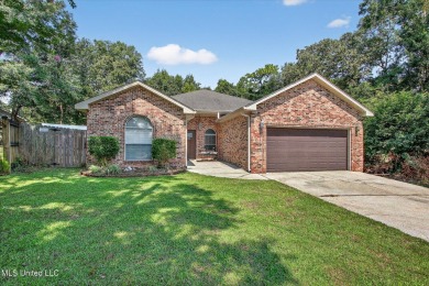 a beautifully maintained and thoughtfully upgraded 4-bedroom on Diamondhead Country Club in Mississippi - for sale on GolfHomes.com, golf home, golf lot