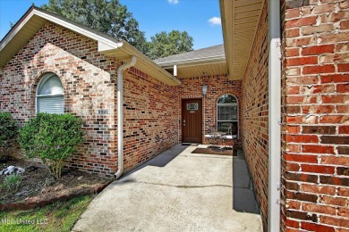 a beautifully maintained and thoughtfully upgraded 4-bedroom on Diamondhead Country Club in Mississippi - for sale on GolfHomes.com, golf home, golf lot