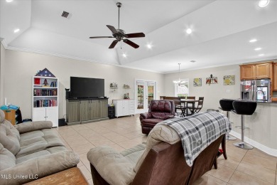 a beautifully maintained and thoughtfully upgraded 4-bedroom on Diamondhead Country Club in Mississippi - for sale on GolfHomes.com, golf home, golf lot