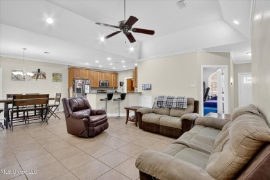 a beautifully maintained and thoughtfully upgraded 4-bedroom on Diamondhead Country Club in Mississippi - for sale on GolfHomes.com, golf home, golf lot