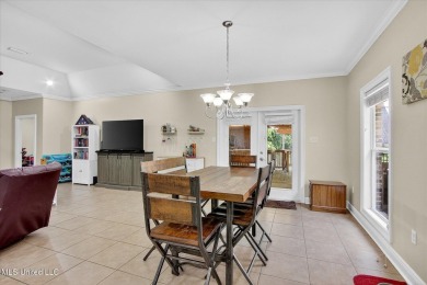 a beautifully maintained and thoughtfully upgraded 4-bedroom on Diamondhead Country Club in Mississippi - for sale on GolfHomes.com, golf home, golf lot