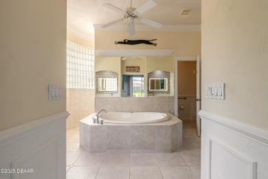 Step into refined living with this spacious executive retreat on Spruce Creek Golf Club in Florida - for sale on GolfHomes.com, golf home, golf lot