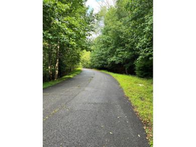 Beautiful wooded lot with seasonal mountain view located in the on Chatuge Shores Golf Course in North Carolina - for sale on GolfHomes.com, golf home, golf lot