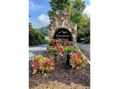 Beautiful wooded lot with seasonal mountain view located in the on Chatuge Shores Golf Course in North Carolina - for sale on GolfHomes.com, golf home, golf lot