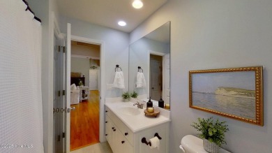 Nestled along the fairway in the gated, amenity-rich community on Harbour Point Golf Club in North Carolina - for sale on GolfHomes.com, golf home, golf lot