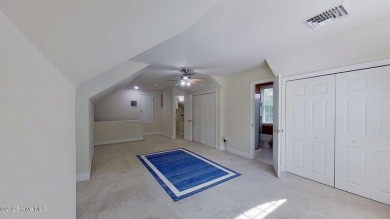 Nestled along the fairway in the gated, amenity-rich community on Harbour Point Golf Club in North Carolina - for sale on GolfHomes.com, golf home, golf lot