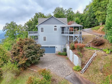 Breathtaking views abound from this 3-bedroom, 3.5-bath home on on Chatuge Shores Golf Course in North Carolina - for sale on GolfHomes.com, golf home, golf lot
