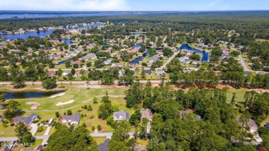 Nestled along the fairway in the gated, amenity-rich community on Harbour Point Golf Club in North Carolina - for sale on GolfHomes.com, golf home, golf lot