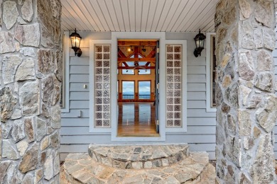 Breathtaking views abound from this 3-bedroom, 3.5-bath home on on Chatuge Shores Golf Course in North Carolina - for sale on GolfHomes.com, golf home, golf lot