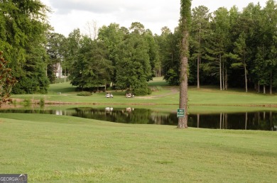 Nestled on a spacious .65-acre lot within the prestigious on Bear Creek Golf Club Inc in Georgia - for sale on GolfHomes.com, golf home, golf lot