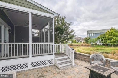 Beautiful Bayside Carriage home overlooking pond with screened on Bayside Resort Golf Club in Delaware - for sale on GolfHomes.com, golf home, golf lot