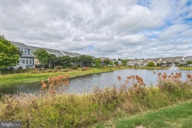 Beautiful Bayside Carriage home overlooking pond with screened on Bayside Resort Golf Club in Delaware - for sale on GolfHomes.com, golf home, golf lot