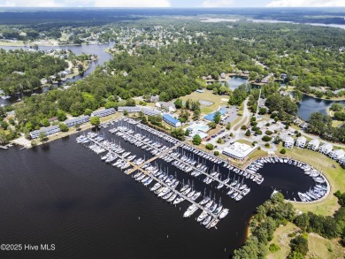 Nestled along the fairway in the gated, amenity-rich community on Harbour Point Golf Club in North Carolina - for sale on GolfHomes.com, golf home, golf lot