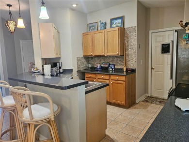 Move-ready 3 bedroom, 2 bath villa in Brentwood with 9 hole on Brentwood Farms Golf Club in Florida - for sale on GolfHomes.com, golf home, golf lot
